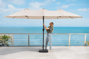 Transformer Table outdoor patio umbrella with canopy providing shade over an outdoor dining area