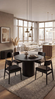 Transformer Table round dining set with expandable round table and matching chairs in a dining room