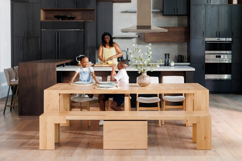 Transformer Table dining set with expandable dining table and matching benches, shown in a modern wood finish