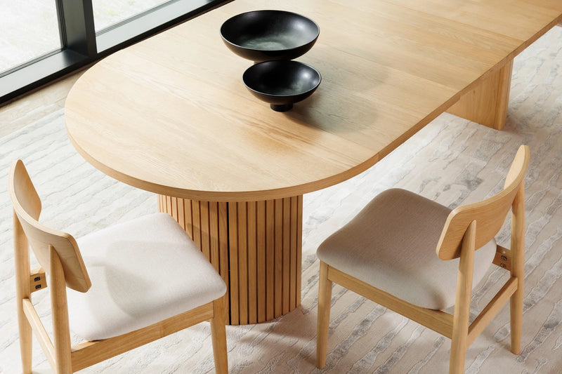 Transformer Table round dining chair in a modern design, shown from the side against a plain background
