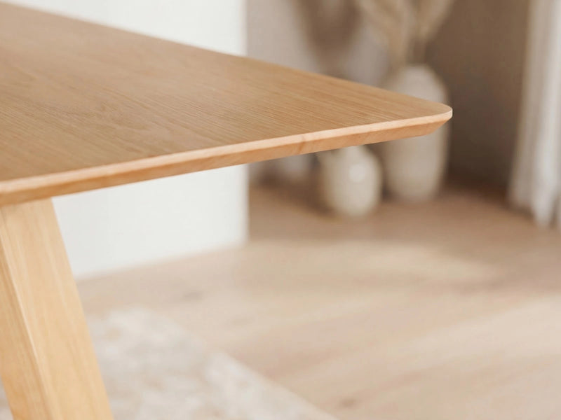 Transformer Table Nova dining table in a modern wood finish, shown fully extended for seating multiple guests
