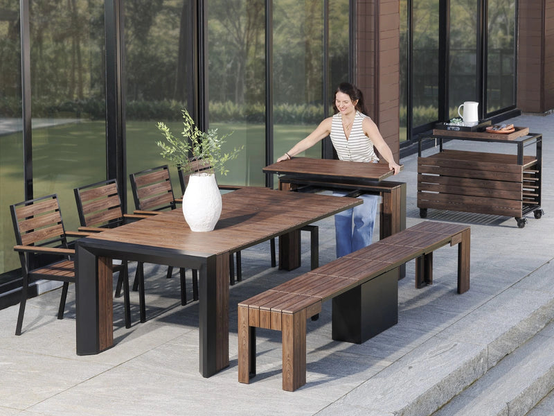 Transformer Table outdoor dining set with expandable table and matching chairs, shown in an outdoor setting