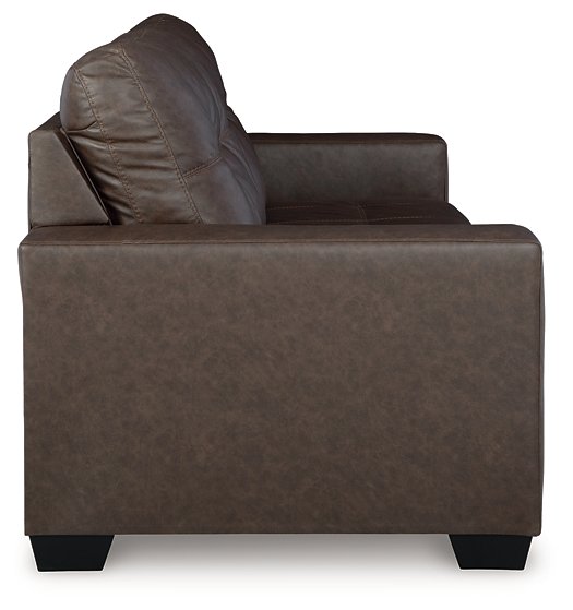 Ashley Furniture Barlin Mills sofa sleeper showing a side view with beige upholstery and a compact, functional design