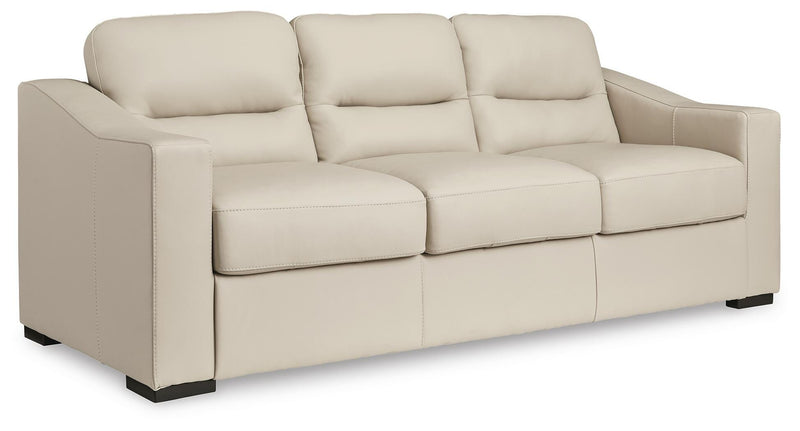 Ashley Furniture Treasure Trove sofa shown from an angled side view, featuring plush cushions and modern design.