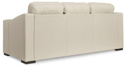 Ashley Furniture Treasure Trove sofa with plush cushions and dark upholstery, shown from the back view.