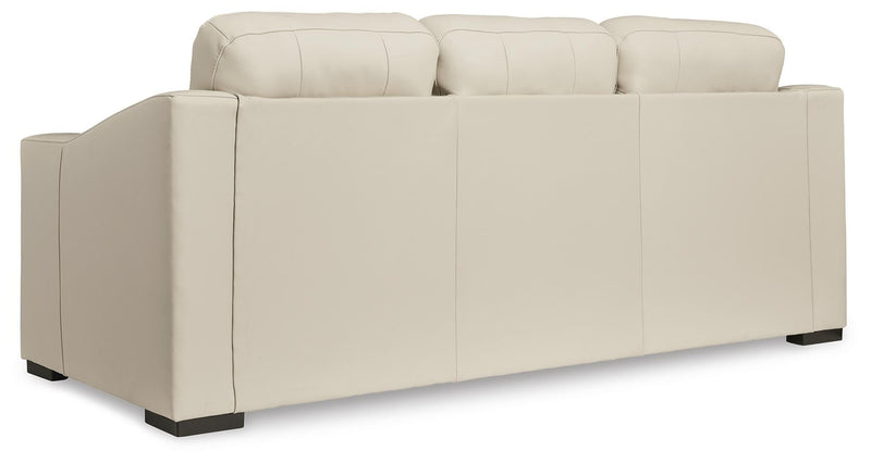 Ashley Furniture Treasure Trove sofa with plush cushions and dark upholstery, shown from the back view.