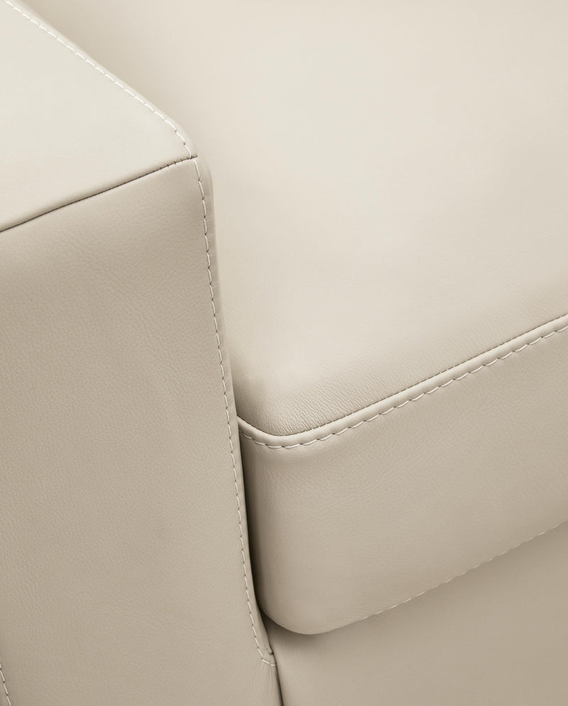 Ashley Furniture Treasure Trove Sofa with detailed stitch upholstery, showcasing plush cushions and elegant design.