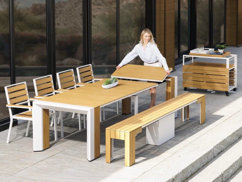 Transformer Table outdoor dining set with expandable table and matching chairs on a patio