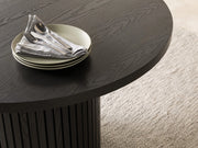Transformer Table round dining table with a smooth tabletop and modern design