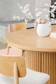 Transformer Table round dining table in a modern design, shown fully assembled for dining use
