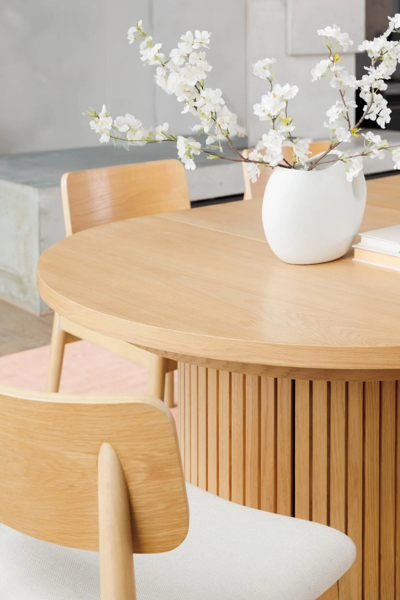 Transformer Table round dining table in a modern design, shown fully assembled for dining use