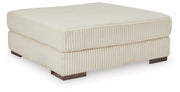 Ashley Furniture Lindyn living room set with sofa and loveseat, beige fabric upholstery, and modern design.