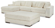 Ashley Furniture Lindyn living room set with sofa and armchair in a modern design, featuring neutral upholstery and sleek wood legs.