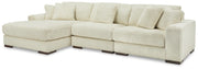 Ashley Furniture Lindyn living room set with sofa and loveseat in neutral upholstery, modern design with plush cushions.