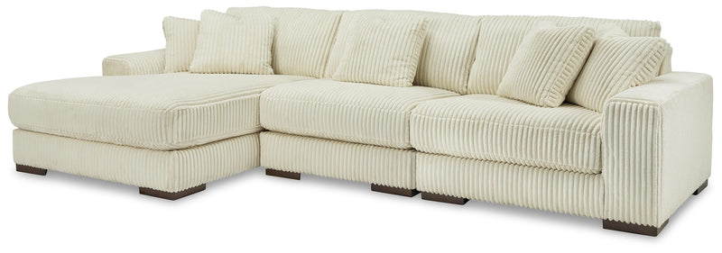 Ashley Furniture Lindyn living room set with sofa and loveseat in neutral upholstery, modern design with plush cushions.
