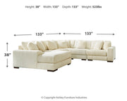 Ashley Furniture Lindyn living room set with sofa and loveseat, featuring neutral upholstery and modern design.