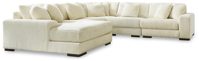 Ashley Furniture Lindyn living room set with sofa, armchair, and coffee table in a modern, stylish living space.