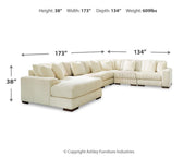 Ashley Furniture Lindyn living room set with sofa and loveseat in neutral fabric, modern style, and plush cushions.