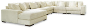 Ashley Furniture Lindyn living room set with sofa, loveseat, and chair in a modern fabric, arranged in a stylish living space.