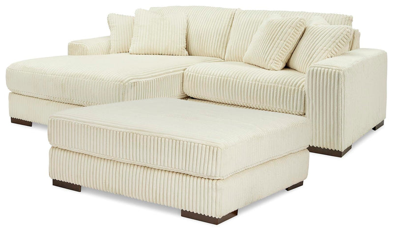 Ashley Furniture Lindyn living room set with sofa and armchair in a modern design, featuring neutral fabric upholstery.