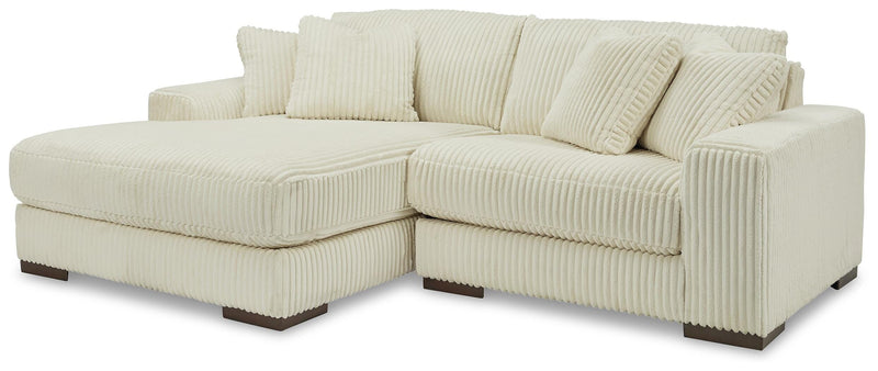 Ashley Furniture Lindyn living room set with sofa, loveseat, and coffee table in a modern design, shown in a well-lit living space.