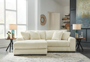 Ashley Furniture Lindyn living room set with sectional sofa and matching ottoman in a modern, neutral fabric.