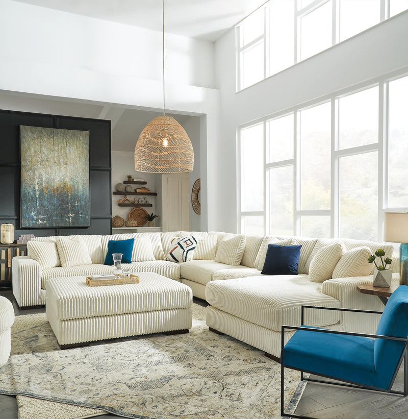 Ashley Furniture Lindyn living room set with sofa, loveseat, and armchair in a modern design with neutral upholstery.