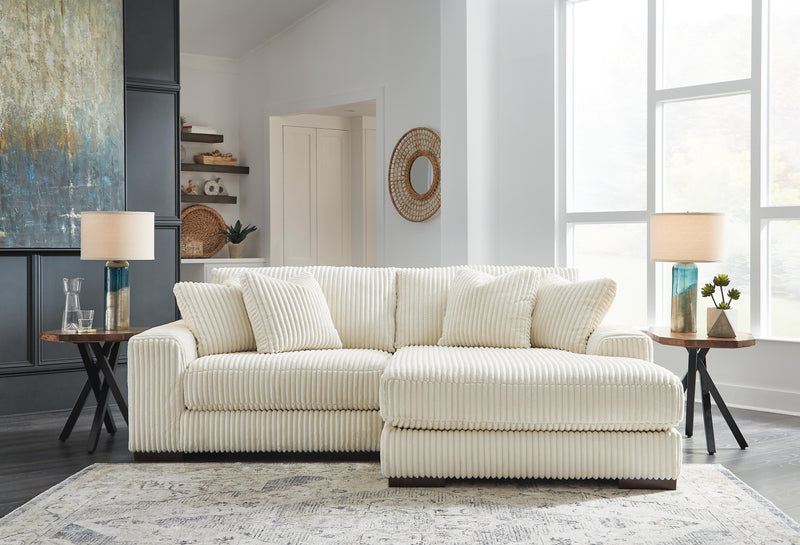 Ashley Furniture Lindyn living room set featuring a sofa and loveseat with neutral fabric and modern design.