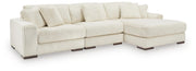 Ashley Furniture Lindyn living room set with sofa, loveseat, and coffee table in a modern design, shown in a cozy living space.