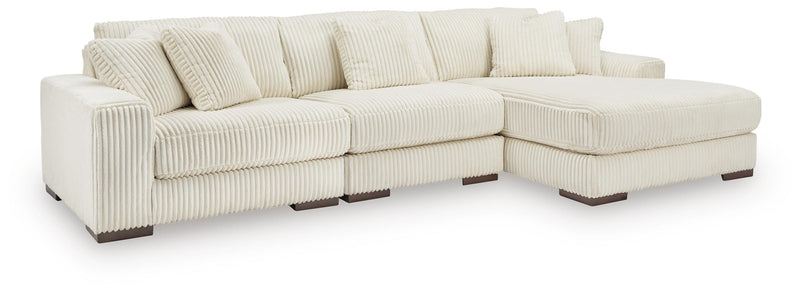 Ashley Furniture Lindyn living room set with sofa, loveseat, and coffee table in a modern design, shown in a cozy living space.
