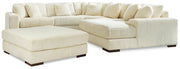Ashley Furniture Lindyn living room set featuring a sofa, loveseat, and matching armchair with neutral upholstery and modern design.