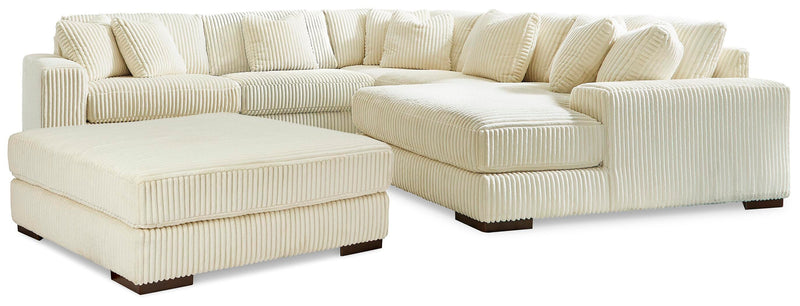 Ashley Furniture Lindyn living room set featuring a sofa, loveseat, and matching armchair with neutral upholstery and modern design.