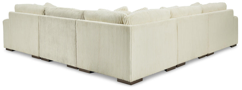 Ashley Furniture Lindyn living room set with sofa and armchair, beige upholstery and modern design.