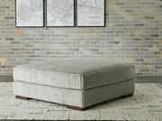 Ashley Furniture Lindyn living room set with sofa and loveseat in neutral fabric, modern design, and plush cushions.