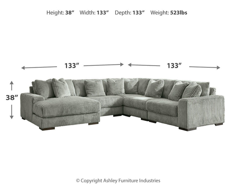 Ashley Furniture Lindyn living room set featuring a plush sofa and loveseat with neutral fabric and modern design.