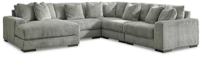 Ashley Furniture Lindyn living room set featuring a sofa, loveseat, and coffee table arranged in a modern, stylish living space.