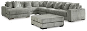 Ashley Furniture Lindyn living room set with sofa, loveseat, and armchair in a modern fabric design, arranged in a stylish living space.