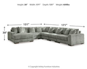 Ashley Furniture Lindyn living room set with sofa, loveseat, and coffee table in a modern design arranged in a living room setting.