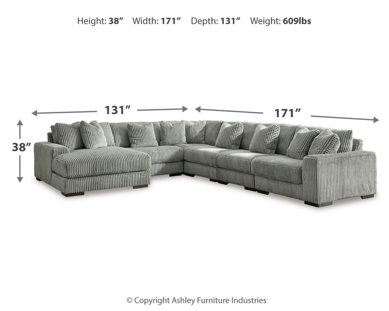 Ashley Furniture Lindyn living room set with sofa, loveseat, and coffee table in a modern design arranged in a living room setting.