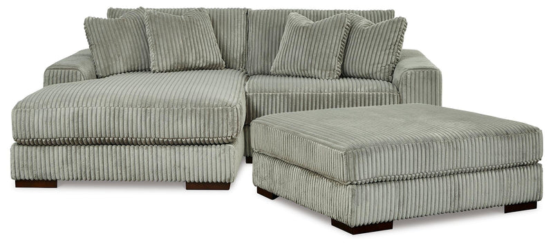 Ashley Furniture Lindyn living room set with sectional sofa and coordinating coffee table in a modern, stylish design.