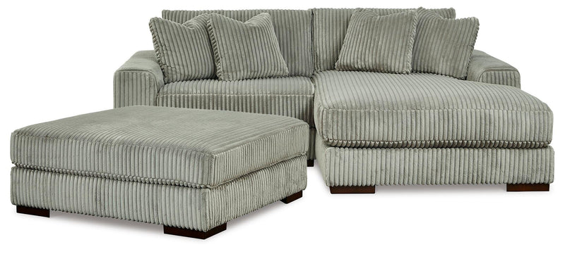 Ashley Furniture Lindyn living room set with sofa and armchair in a modern design, featuring neutral fabric upholstery.