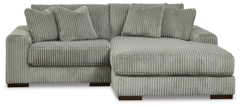 Ashley Furniture Lindyn living room set featuring a plush sofa and matching armchair in a modern design.