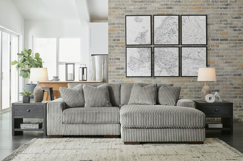 Ashley Furniture Lindyn living room set with sofa, loveseat, and armchair in neutral fabric, stylish and comfortable for modern homes.
