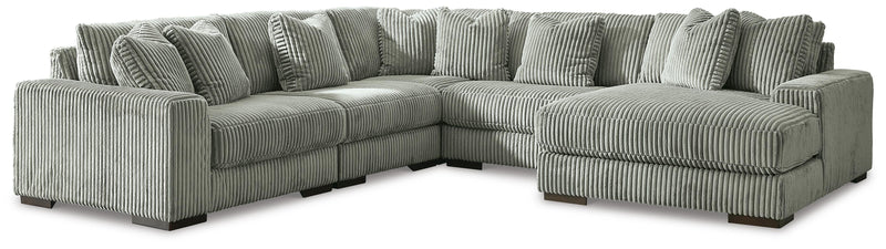 Ashley Furniture Lindyn living room set with plush sofa and armchair, featuring neutral fabric and modern design in a cozy living space.