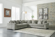 Ashley Furniture Lindyn living room set featuring a sofa, loveseat, and armchair with neutral fabric and modern design.