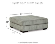 Ashley Furniture Lindyn living room set featuring a sofa, loveseat, and armchair with neutral fabric and modern design.