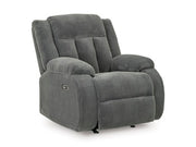 Ashley Furniture observation power recliner with plush upholstery and adjustable backrest, viewed from an angled closed position.