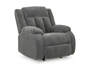 Ashley Furniture observation power recliner with plush upholstery and adjustable backrest, viewed from an angled closed position.