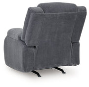Ashley Furniture observation power recliner with plush upholstery and adjustable backrest, shown from the back.