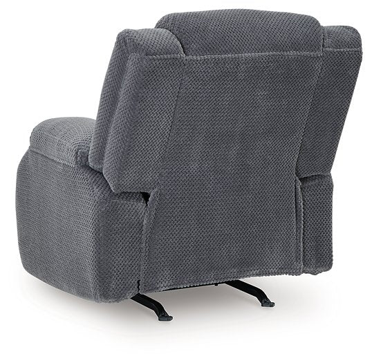 Ashley Furniture observation power recliner with plush upholstery and adjustable backrest, shown from the back.
